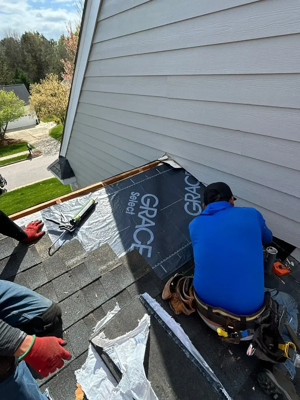 On Tops Roofing technician performing a targeted roof repair on a Cary, NC home