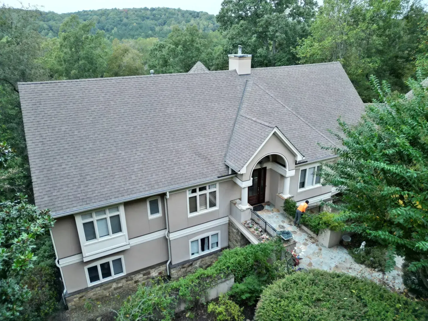 Aerial completion view of Chapel Hill roof replacement at Governors Club with new gray shingles, white trim, and cupola