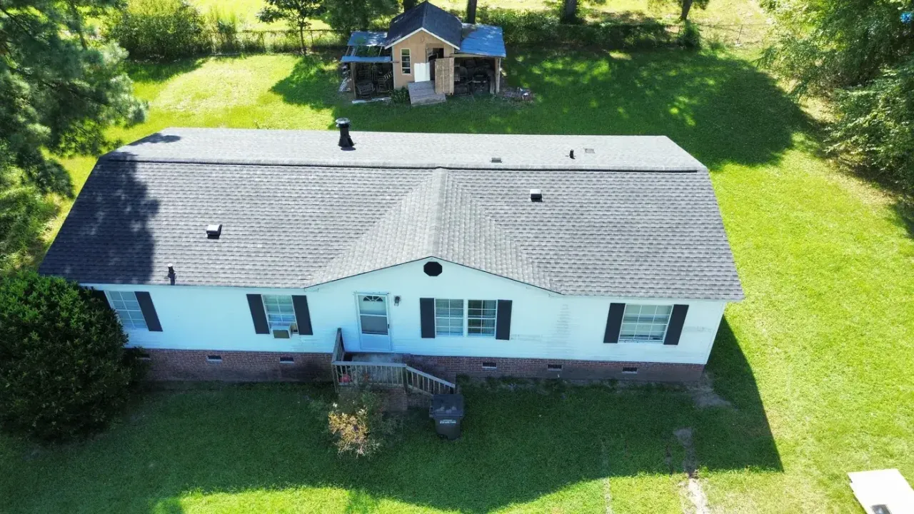 Completed roof replacement with Charcoal GAF Timberline Ultra HDZ shingles on Harrison Ave in Fuquay-Varina, NC