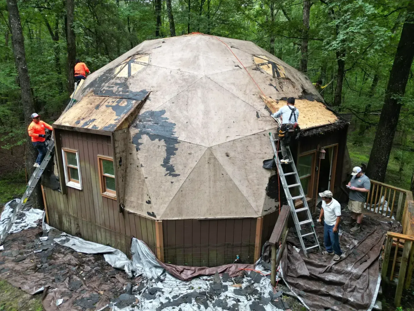 On Tops Roofing crew installing new shingles on a Chapel Hill home on Hawk Ridge Rd with safety equipment and staging