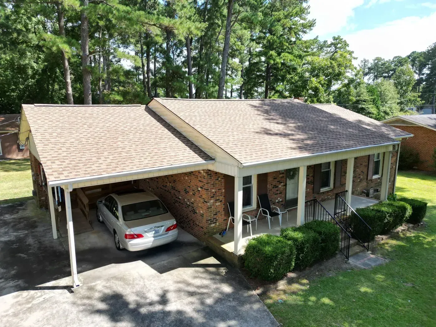 Close-up of a finished roof repair section on Lemon Springs Rd in Sanford, NC with matching GAF Shakewood shingles