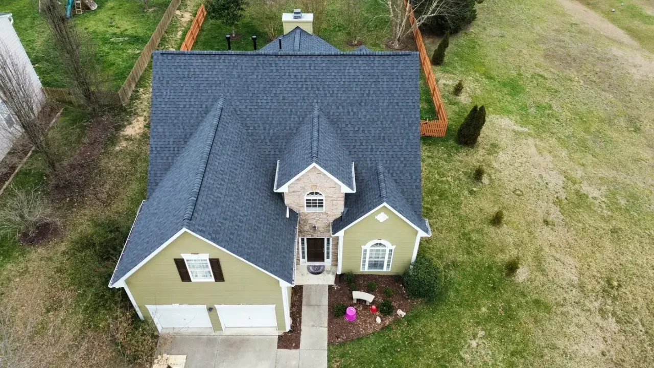 Completed roof replacement with Moire Black CertainTeed Landmark shingles on Margots Ave in Wake Forest, NC