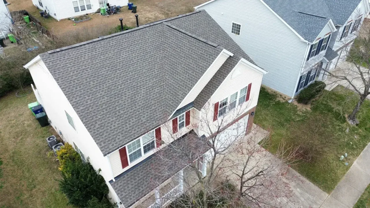 Completed roof replacement with Weathered Wood GAF Timberline HDZ shingles on Roaring Rapids Road in Raleigh, NC