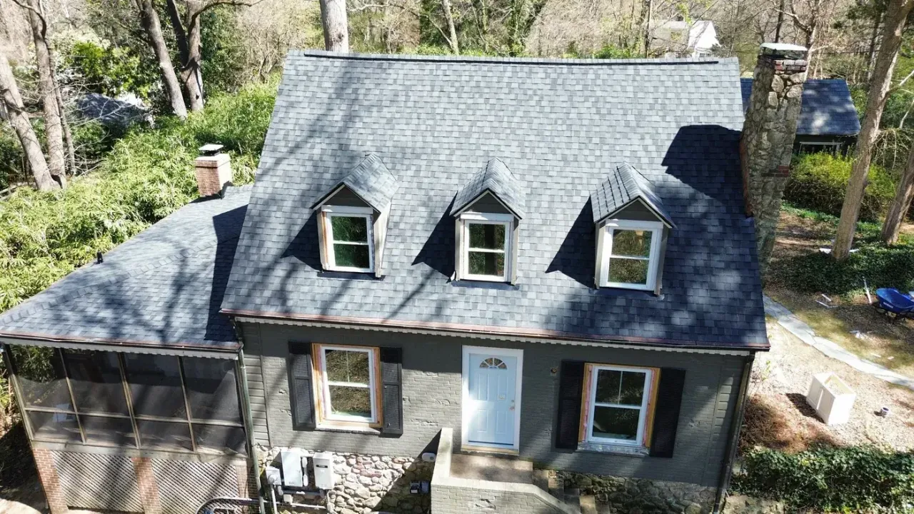 Completed roof replacement with Moire Black CertainTeed Landmark Premium shingles on Roosevelt Dr in Chapel Hill, NC