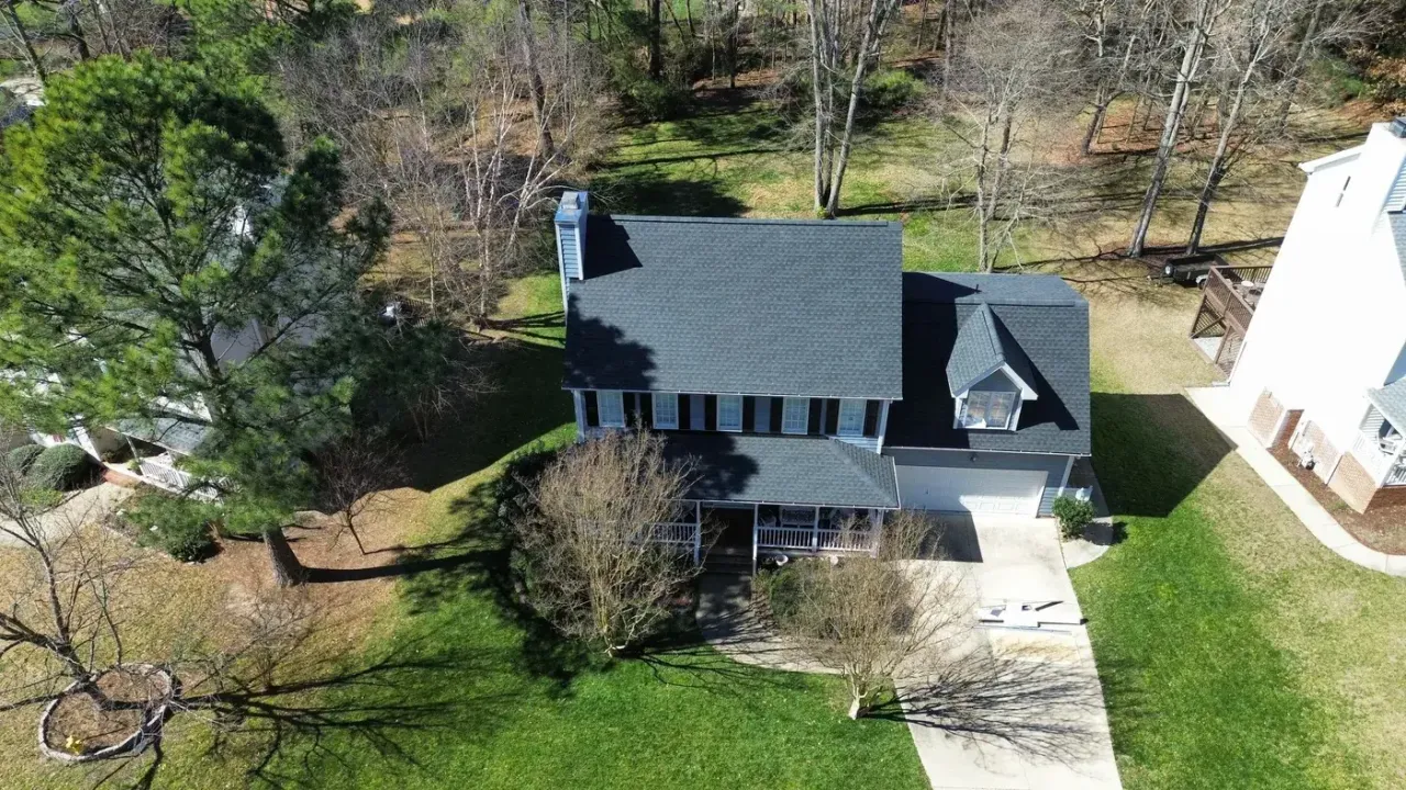 Completed roof replacement with Charcoal GAF Timberline HDZ shingles on Sandy Point Way in Holly Springs, NC