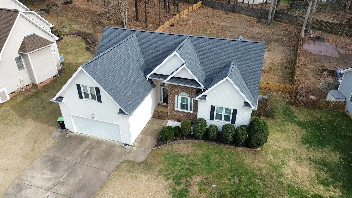 Completed On Tops Roofing project on Saranac Ridge Dr in Holly Springs, NC with new GAF Timberline HDZ Pewter Gray architectural shingles