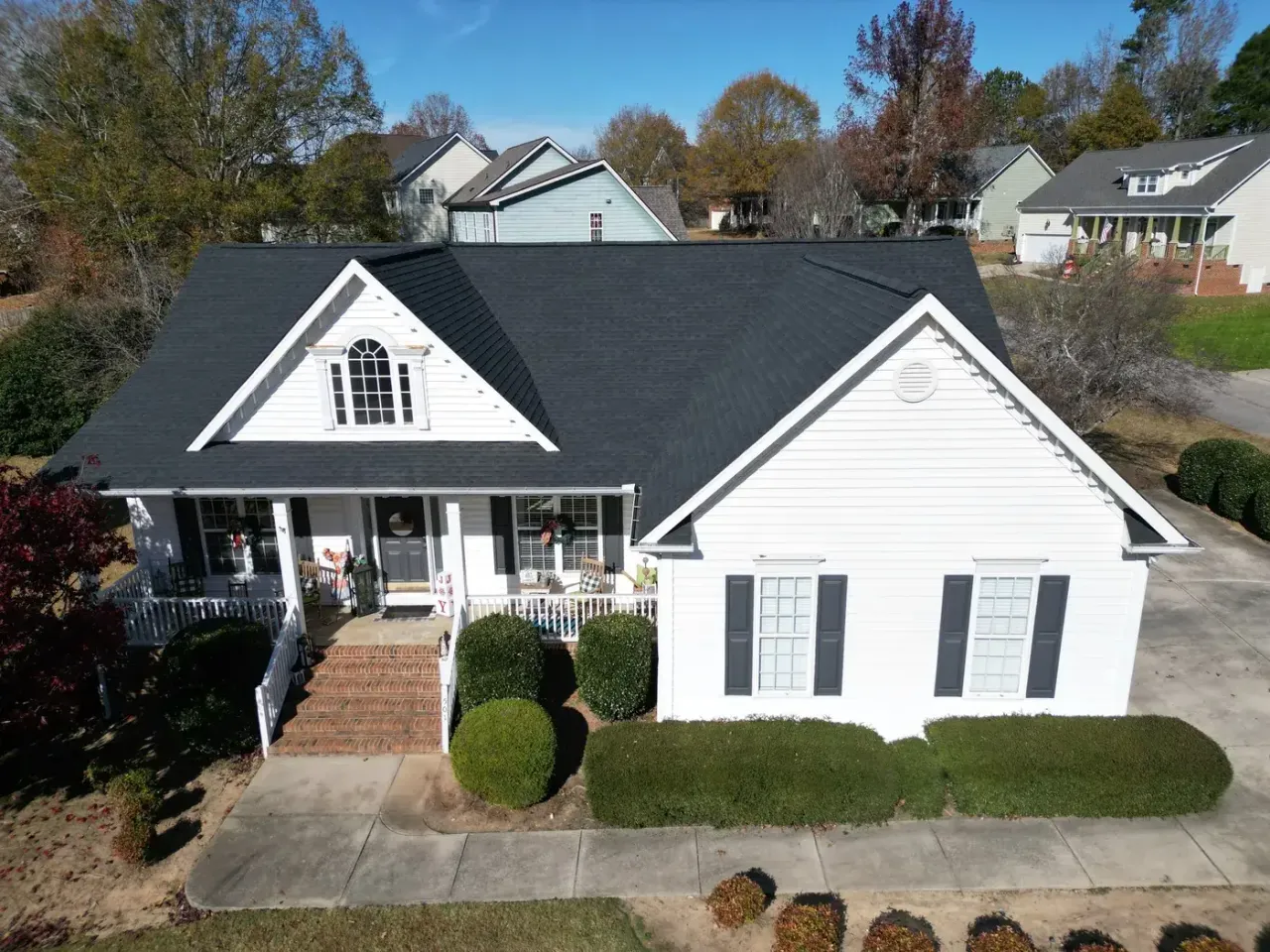 Completed roof replacement with Charcoal GAF Timberline Natural Shadow shingles on Sarazen Dr in Clayton, NC
