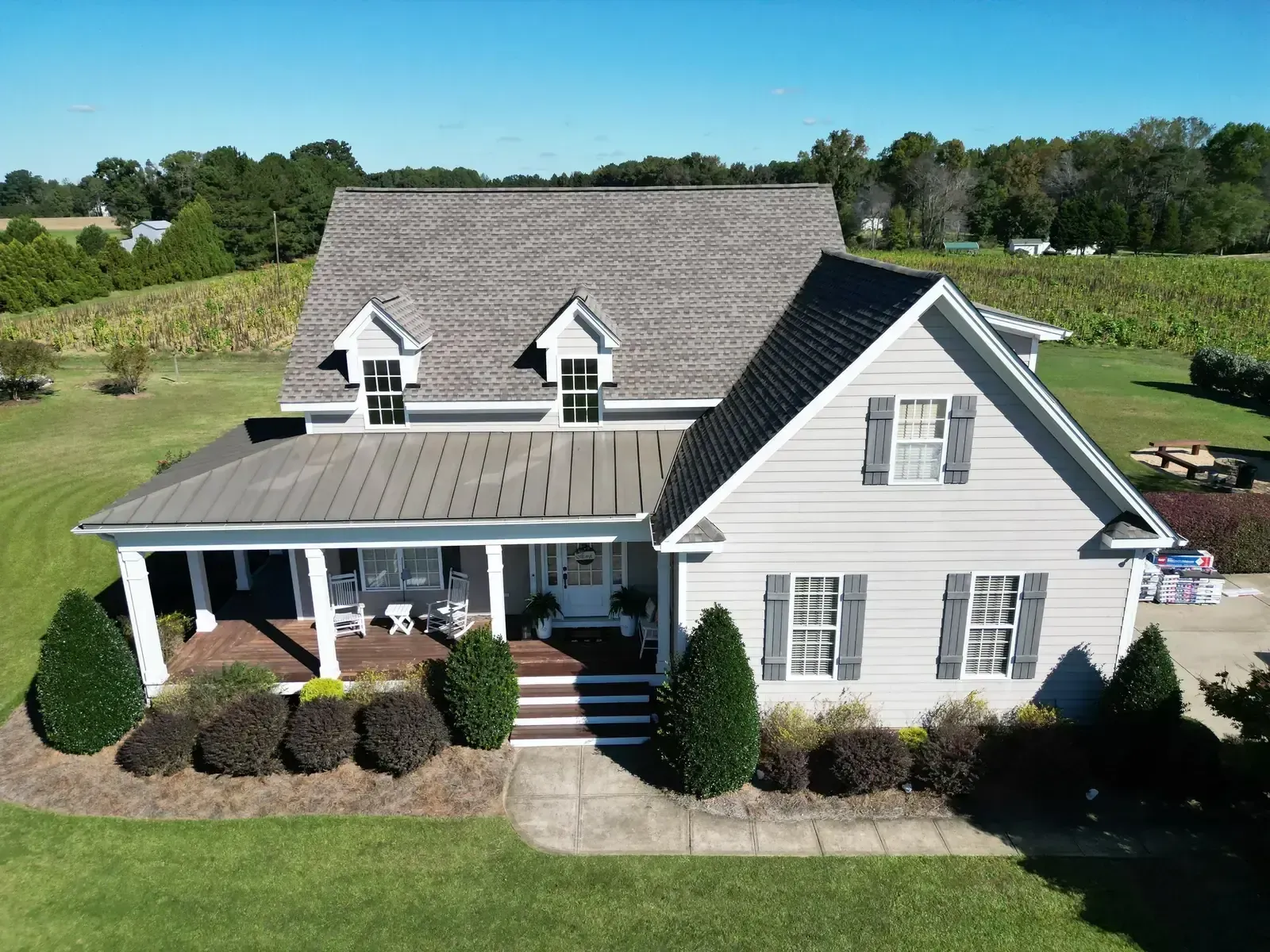 On Tops crew replacing a roof on a farmhouse in Holly Springs, NC