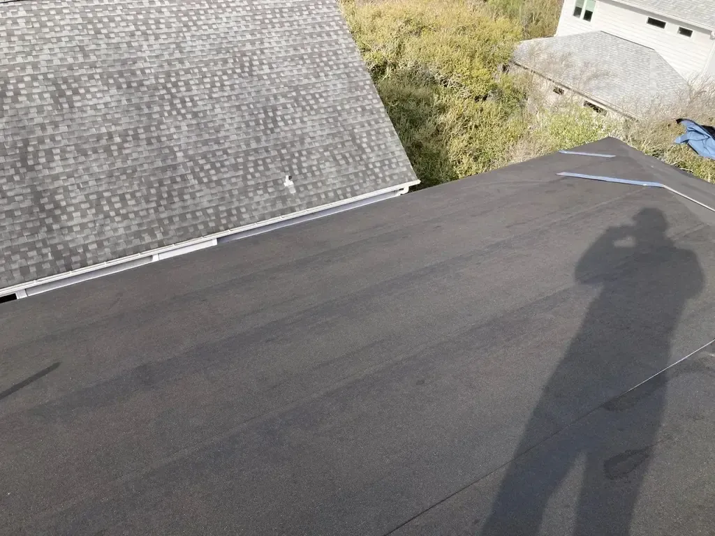 Self-adhered peel-and-stick underlayment membrane covering an entire roof deck on a FORTIFIED installation