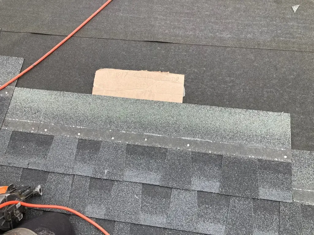 Architectural shingles being installed to a high-wind nailing pattern on a FORTIFIED roof in North Carolina